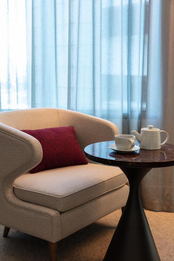 Next Hotel Melbourne, Curio Collection By Hilton Exterior photo A tea set